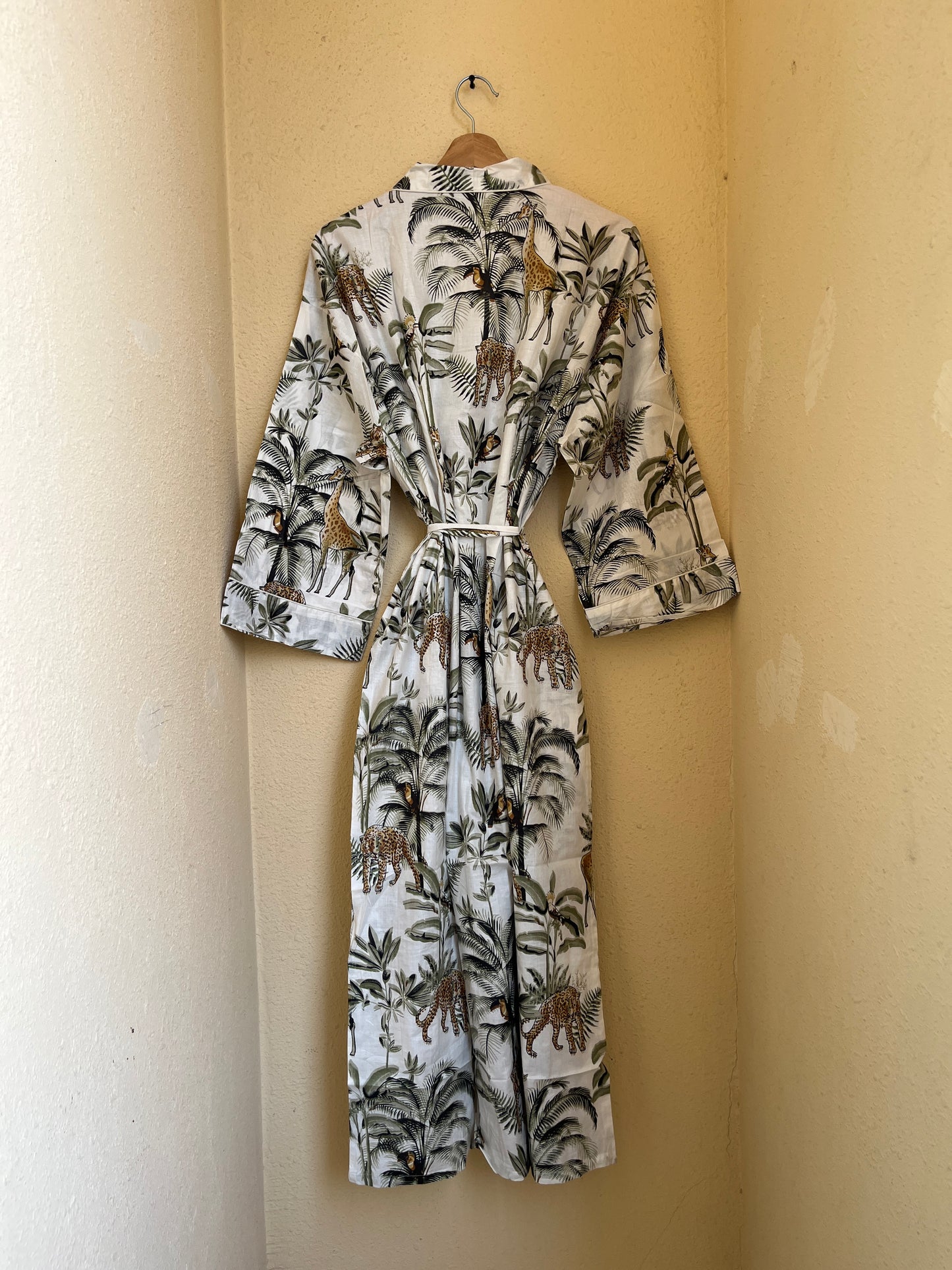 White Jungle Muse women's cotton kimono. Tropical botanical and
jungle print lightweight cotton housecoat in white and green.