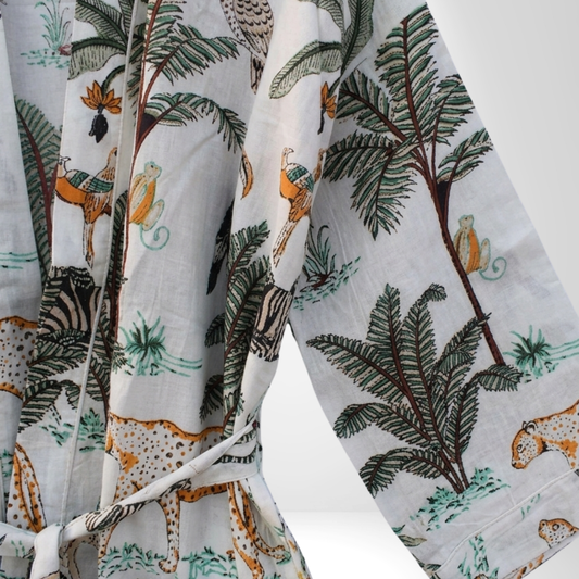 White safari women's cotton kimono. Clean white lightweight
 cotton robe featuring detailed safari animal and jungle illustrations.