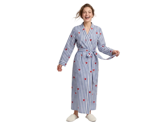 Woman wearing a blue and white striped robe with red heart patterns on a white background