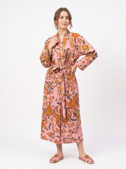 Woman wearing a floral patterned robe on a white background
